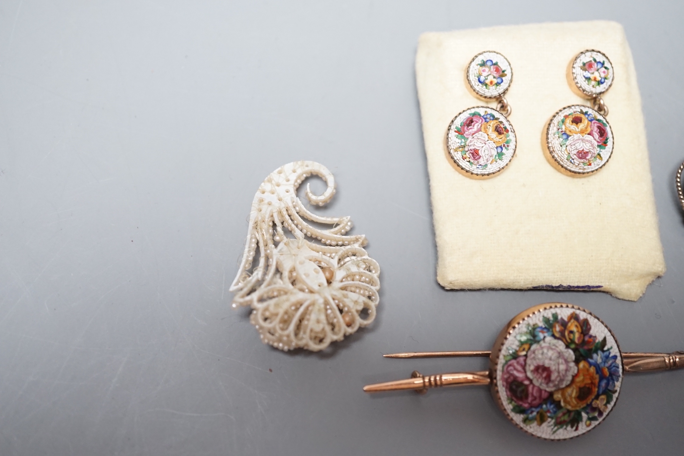 A suite of yellow metal and micro mosaic jewellery comprising a brooch, 72mm and pair of earrings, five items of seed pearl jewellery and a brooch.